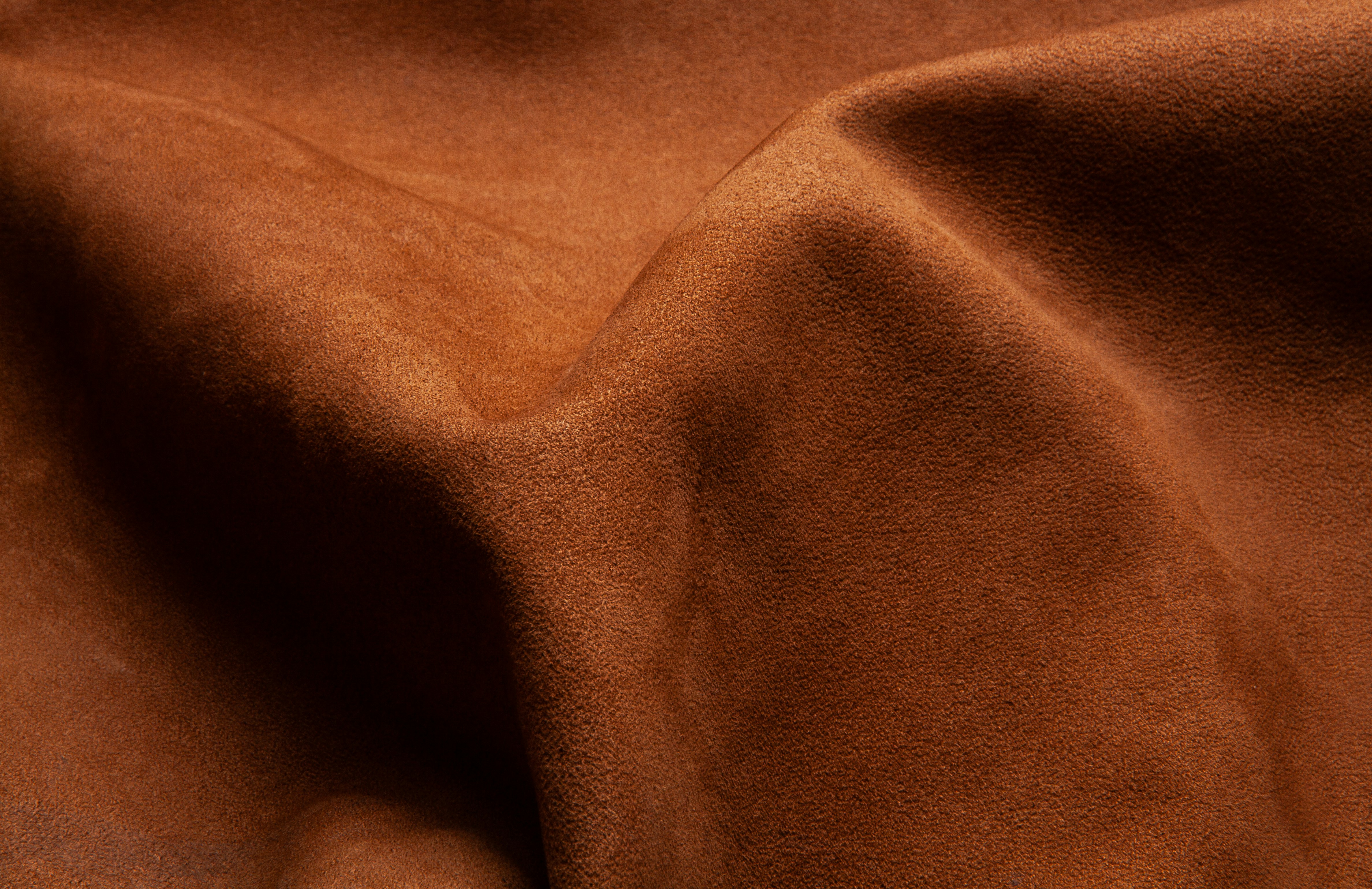 Close detail of hand-cut saddle leather